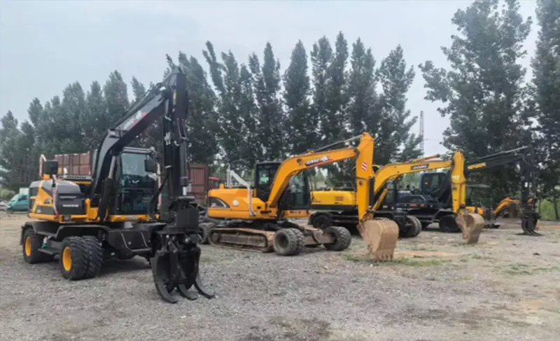 Used mini excavator being inspected before purchase